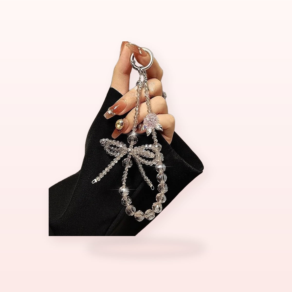 SIMPLYBUBBI Rhinestone Bow Wrist Strap - Image 1